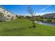 Nice backyard with pond view and lush green grass at 5725 Haven Ter, Nokomis, FL 34275