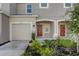 Townhouse exterior with attached garage and landscaping at 5725 Haven Ter, Nokomis, FL 34275