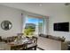 Open concept living space with dining area and patio access at 5725 Haven Ter, Nokomis, FL 34275