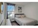 Bright bedroom with double bed and window at 5725 Haven Ter, Nokomis, FL 34275