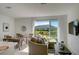 Living room with sliding glass doors leading to patio and lake view at 5725 Haven Ter, Nokomis, FL 34275