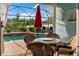 Cozy patio with wicker furniture and view of the pool at 7160 Spikerush Ct, Lakewood Ranch, FL 34202