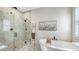 Bright bathroom with a large walk-in shower and soaking tub at 4653 Antrim Dr, Sarasota, FL 34240