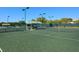 Well-maintained tennis courts with shaded seating areas at 5283 Heron Way # 204, Sarasota, FL 34231