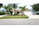 White single story home with palm trees and a two-car garage at 3417 50Th W St, Bradenton, FL 34209