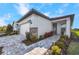 Exterior view of a single-story home with attached garage and landscaped walkway at 10646 Spring Tide Way, Parrish, FL 34219