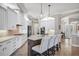 Modern kitchen featuring white cabinetry, granite countertops, and stainless-steel appliances at 14619 Leopard Creek Pl, Lakewood Ranch, FL 34202