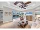 Inviting living room featuring custom ceiling design, pool views, and a seamless indoor-outdoor flow at 14619 Leopard Creek Pl, Lakewood Ranch, FL 34202