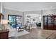 Open-concept living area with tile flooring, neutral paint, and seamless transition to the outdoor space at 14619 Leopard Creek Pl, Lakewood Ranch, FL 34202