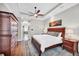 A bright main bedroom featuring a spacious layout with a walk-in closet and a view of the ensuite bathroom at 14619 Leopard Creek Pl, Lakewood Ranch, FL 34202