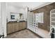 Modern bathroom boasts double vanity, granite countertop, and a glass block shower enclosure, offering privacy and light at 1884 Grove St, Sarasota, FL 34239