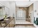 Well-designed bathroom featuring dual sinks, granite countertops, and a modern glass block shower enclosure at 1884 Grove St, Sarasota, FL 34239