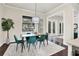 The dining room is complete with modern light fixture and view to the screened lanai at 1884 Grove St, Sarasota, FL 34239
