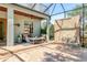 Enclosed patio with a stone water feature, and outdoor seating area at 1884 Grove St, Sarasota, FL 34239