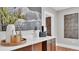 Stylish bar area with quartz countertop and wooden cabinetry at 3101 Riverview Blvd, Bradenton, FL 34205