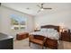 Large main bedroom with a king-size bed and ceiling fan at 3722 Mossy Limb Ct, Palmetto, FL 34221