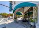 Veronica Cocktails storefront with teal awning, plants, and outdoor seating at 1884 Grove St, Sarasota, FL 34239