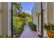 Brick pathway leading through a beautifully landscaped garden at 1884 Grove St, Sarasota, FL 34239