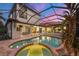 Luxury pool and spa with covered patio and sunset views at 14619 Leopard Creek Pl, Lakewood Ranch, FL 34202