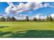 Scenic golf course with lush green fairways and blue skies at 14619 Leopard Creek Pl, Lakewood Ranch, FL 34202