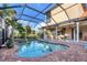 Relaxing pool and spa with covered patio and golf course view at 14619 Leopard Creek Pl, Lakewood Ranch, FL 34202