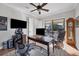 Home office featuring a large desk and ample natural light at 14619 Leopard Creek Pl, Lakewood Ranch, FL 34202