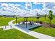 Covered picnic pavilion with tables and benches at 14607 Swiss Bridge Dr, Lithia, FL 33547