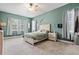 Serene bedroom with light green walls and ample closet space at 14607 Swiss Bridge Dr, Lithia, FL 33547