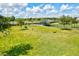 Community dog park with fenced area, agility equipment, and shaded seating at 14607 Swiss Bridge Dr, Lithia, FL 33547