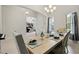 Elegant dining room with light wood table at 14607 Swiss Bridge Dr, Lithia, FL 33547