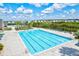 Community lap pool with surrounding lounge area at 14607 Swiss Bridge Dr, Lithia, FL 33547