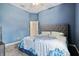 Blue bedroom with king-size bed and ceiling fan at 14607 Swiss Bridge Dr, Lithia, FL 33547