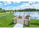 Wooden dock offering scenic views of a tranquil lake at 14607 Swiss Bridge Dr, Lithia, FL 33547