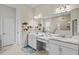 Double vanity bathroom with marble countertop and large mirror at 14607 Swiss Bridge Dr, Lithia, FL 33547