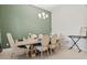 Dining room with light walls and a statement wall at 14607 Swiss Bridge Dr, Lithia, FL 33547
