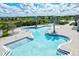 Community pool with multiple areas for swimming and lounging at 14607 Swiss Bridge Dr, Lithia, FL 33547