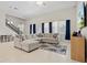 Spacious living room with sectional sofa, large windows, and tile floors at 14607 Swiss Bridge Dr, Lithia, FL 33547