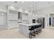 Spacious kitchen with white cabinets, large island, and stainless steel appliances at 14607 Swiss Bridge Dr, Lithia, FL 33547
