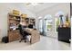 Home office with built-in shelving and desk at 14607 Swiss Bridge Dr, Lithia, FL 33547