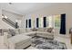 Spacious living area with sectional sofa and large windows at 14607 Swiss Bridge Dr, Lithia, FL 33547