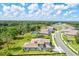 Aerial view of homes with tile roofs and lush landscaping at 14607 Swiss Bridge Dr, Lithia, FL 33547