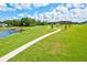 Scenic community park with walking paths, playground, and pond at 14607 Swiss Bridge Dr, Lithia, FL 33547