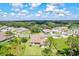 Aerial view of homes with tile roofs and lush landscaping at 14607 Swiss Bridge Dr, Lithia, FL 33547
