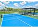 Well-maintained pickleball court with seating at 14607 Swiss Bridge Dr, Lithia, FL 33547