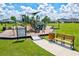 playground with play equipment and shaded seating at 14607 Swiss Bridge Dr, Lithia, FL 33547