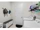 Convenient laundry room with washer, dryer, and storage shelves at 14607 Swiss Bridge Dr, Lithia, FL 33547