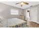 Bright bedroom with a ceiling fan and en-suite bathroom at 251 Plantation Rd, Venice, FL 34293
