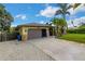 Single-Gathering home with two-car garage and gravel driveway at 251 Plantation Rd, Venice, FL 34293