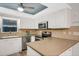 Modern kitchen with stainless steel appliances and light wood floors at 251 Plantation Rd, Venice, FL 34293