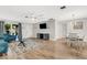 Bright living room featuring hardwood floors, comfortable seating, and a dining area at 251 Plantation Rd, Venice, FL 34293